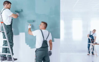 Men painting empty home interior