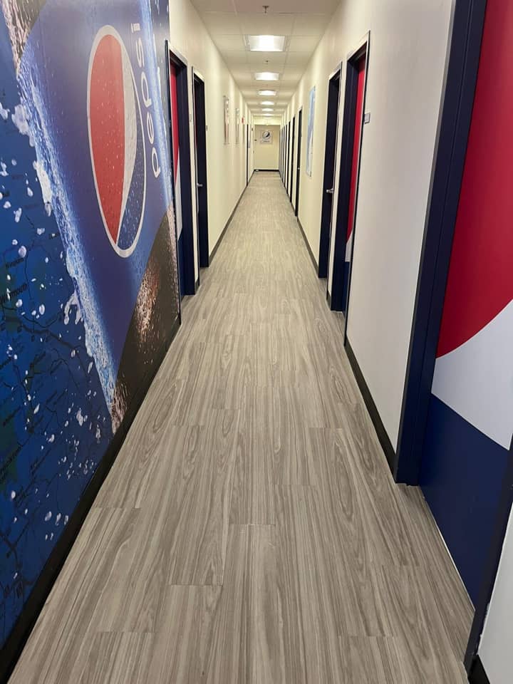 Pepsi wallpaper art in a long hallway