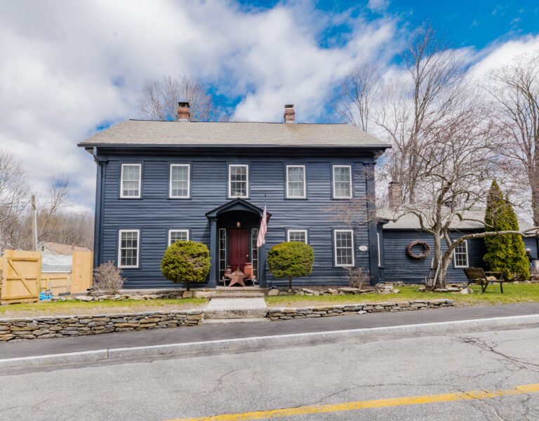 Full exterior restoration of home at 8 Maple St, Sterling, including siding, trim, and paint updates