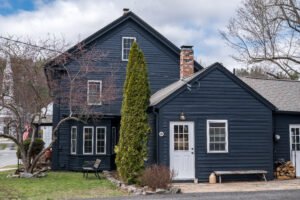 Full exterior restoration of home at 8 Maple St, Sterling, including siding, trim, and paint updates