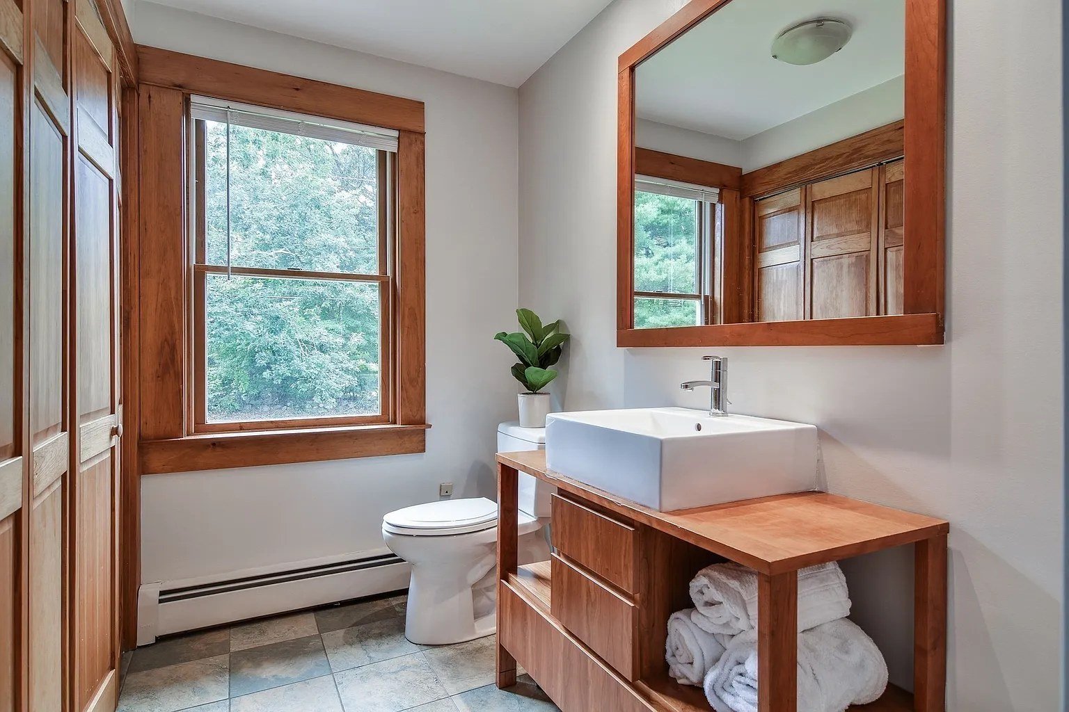 Bathroom with baseboard heating, remodeled by Ulta Home